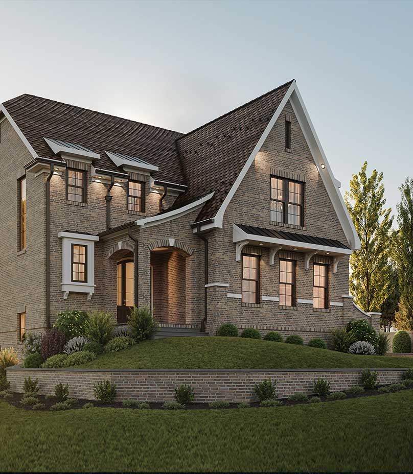 The Woodmont's English Cottage inspired front elevation featuring a unique arched brick entryway.