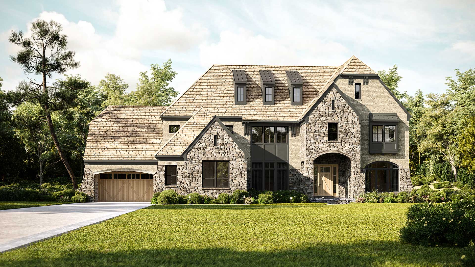Exterior view of a large, two-story stone house with a steeply pitched shingled roof, an arched entryway, dark window trim, and a green front lawn.