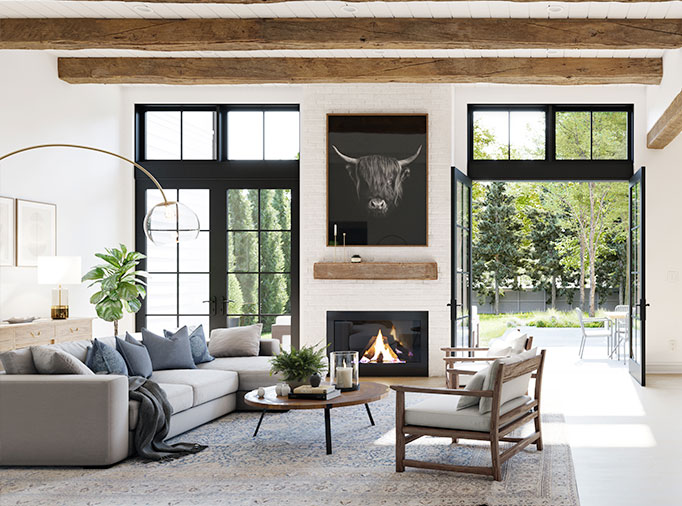 A modern farmhouse style family room with rustic natural exposed beams, rustic beam fireplace mantle, white walls, black windows and double doors to the patio.