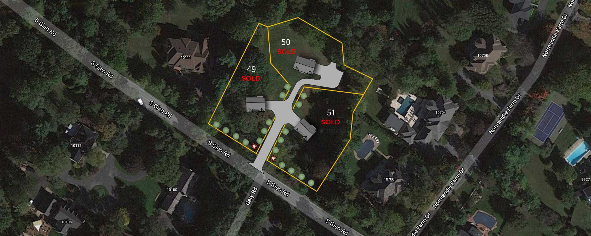 An aerial satellite image showing a three lot subdivision lot outline superimposed with proposed house placement, all three lots are marked SOLD