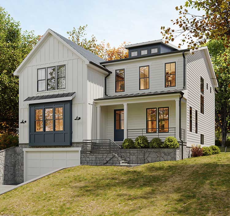 A modern farmhouse with drive under garage, white with dark windows and dark blue accents including window assembly and front door.