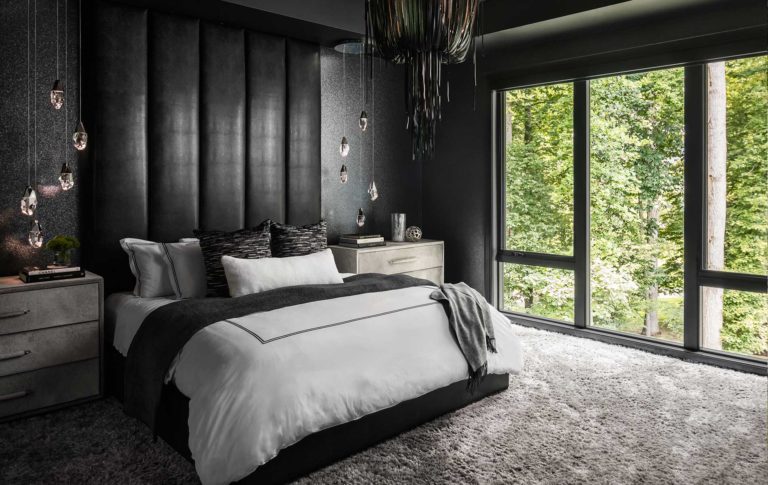 An Owner's Suite with unique dark custom styling contrasted against the bright natural light.