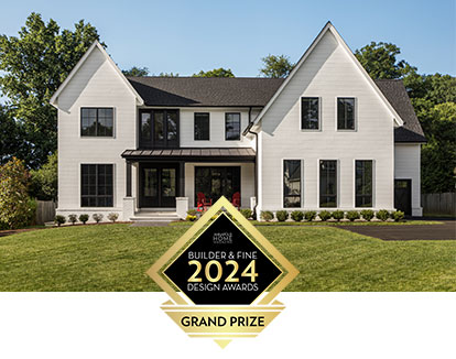 The Annapolis Home Magazine logo for the 2024 Builder & Fine Design Awards - Grand Prize in front of a white modern farmhouse design.