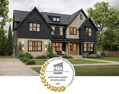 MBIA MAX Award logo in front of a modern farmhouse exterior in black board and batten and stone, with black windows and natural wood details.