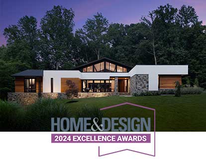 The Home & Design Excellence Awards 2024 logo in front of a California modern style custom home