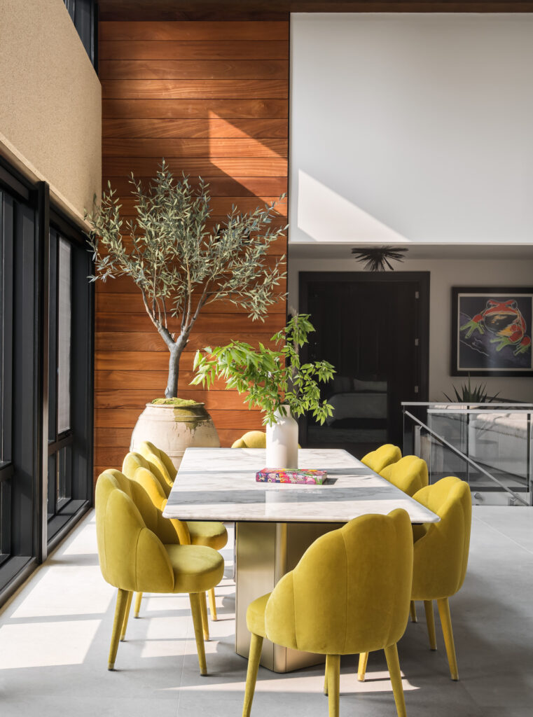 The dining area with wood paneled accent matching the exterior.