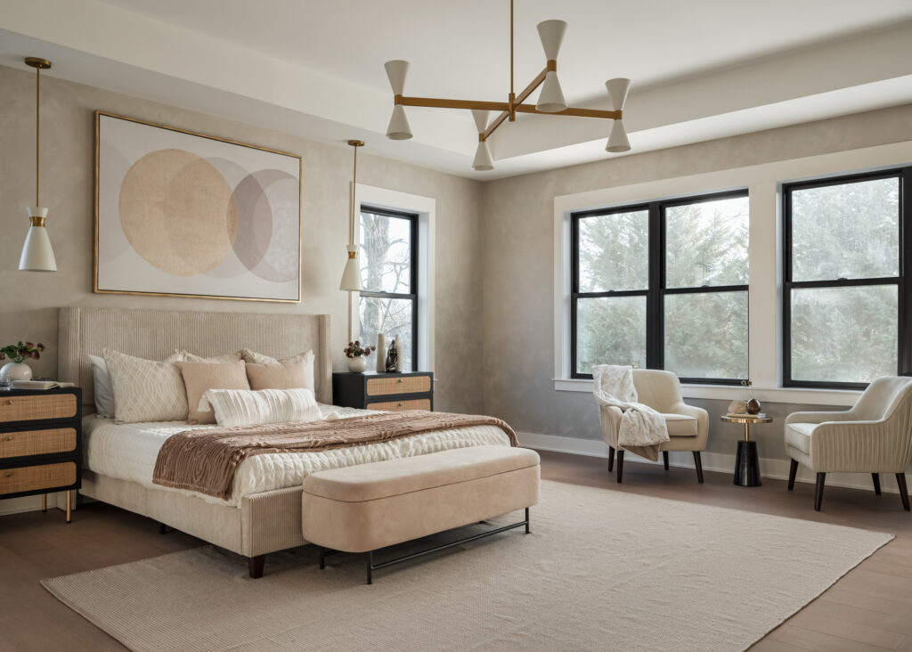 An owner's suite with dark windows, faux limewash hand painted walls and matching furniture, modern light fixtures in white and brass