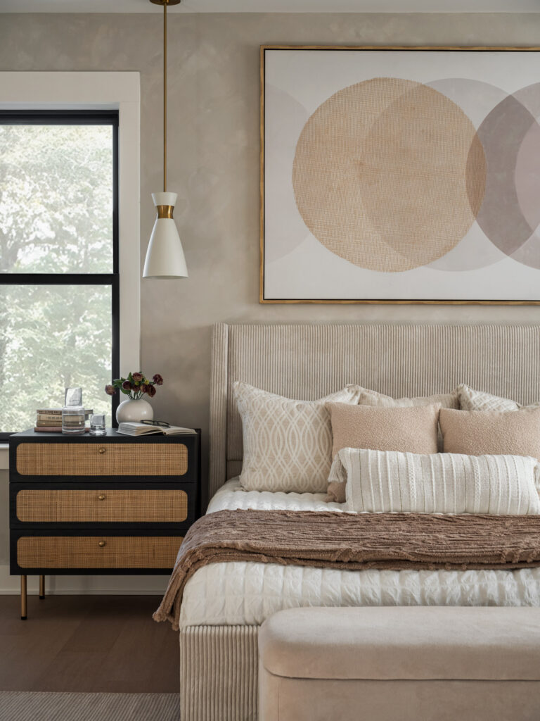 An owner's suite with dark windows, faux limewash hand painted walls and matching furniture